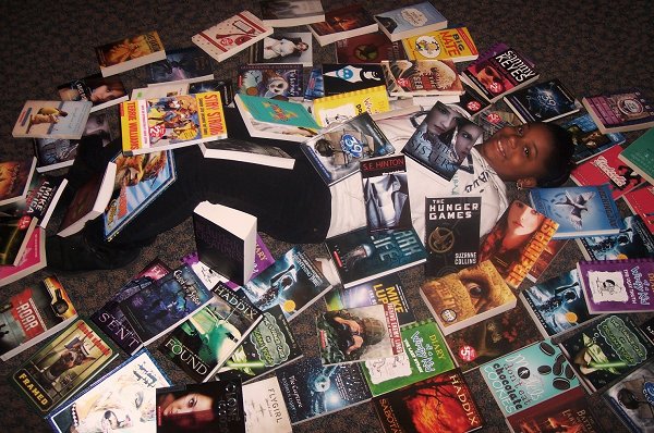 Chabriane with library books from Scholastic Book Fair