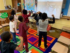 students dancing in music room 